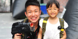 young children playing laser tag