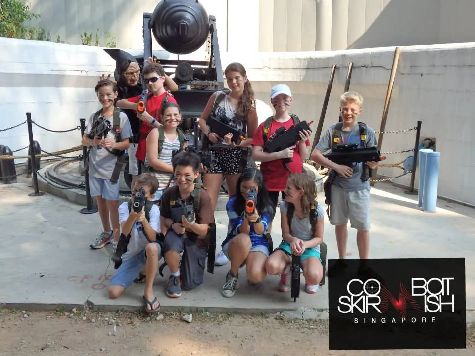 Family planning a mobile laser tag event, highlighting the convenience and process of booking with Combat Skirmish Singapore